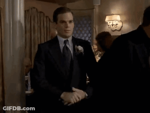 Man In Suit And Tie Screaming In Room GIF