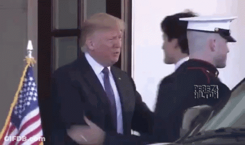 Man In Suit And Tie Shaking Hands With Marine GIF