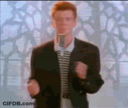 Man In Suit And Tie Singing Into Microphone GIF
