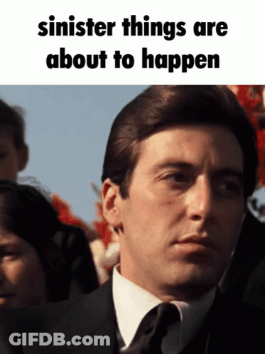 Man In Suit And Tie Sinister Things Are About To Happen GIF