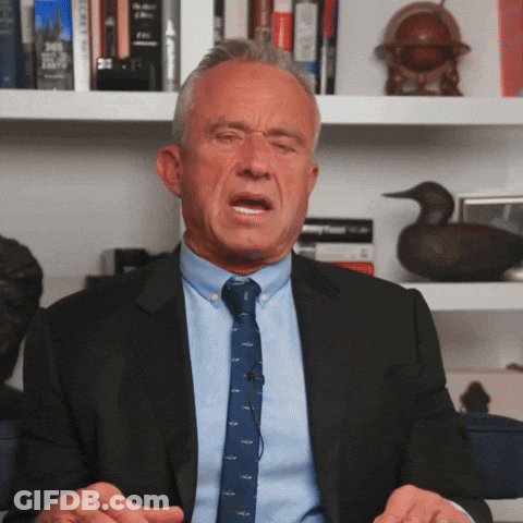 Man In Suit And Tie Sitting GIF