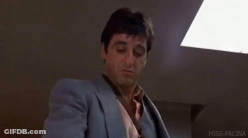 Man In Suit And Tie Sitting GIF