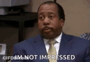 Man In Suit And Tie Sitting At Computer GIF