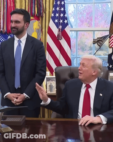 Man In Suit And Tie Sitting At Desk GIF