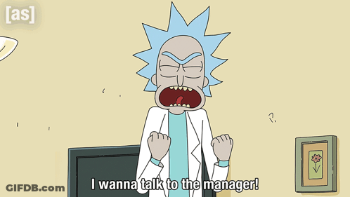 Man In Suit And Tie Sitting At Desk GIF