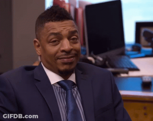 Man In Suit And Tie Sitting At Laptop GIF