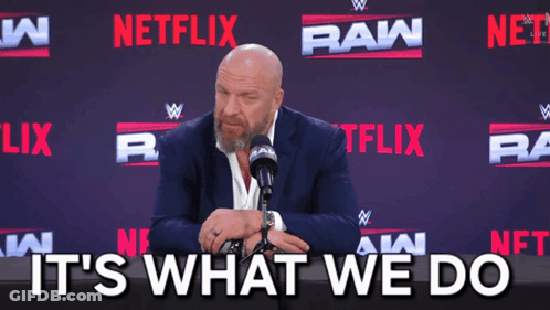 Man In Suit And Tie Sitting At Microphone GIF