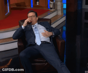 Man In Suit And Tie Sitting Cross-Legged GIF