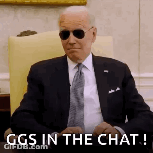 Man In Suit And Tie Sitting In Chair GIF