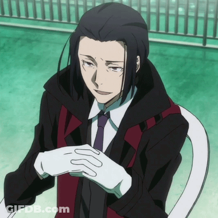 Man In Suit And Tie Sitting In Chair GIF