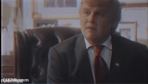 Man In Suit And Tie Sitting In Chair Saying Funny Die GIF