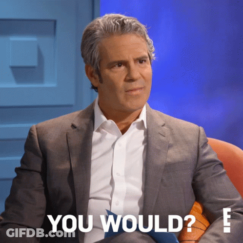 Man In Suit And Tie Sitting In Front Of Blue Wall With You Would Text GIF