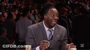 Man In Suit And Tie Sitting In Front Of Screen Saying Wwetlg GIF