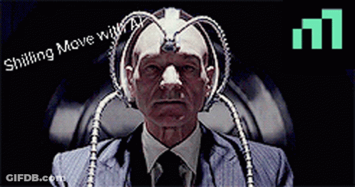 Man In Suit And Tie Sitting In Front Of Shilling Move Sign GIF