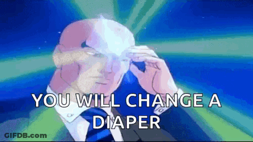 Man In Suit And Tie Sitting In Wheelchair Holding Remote GIF