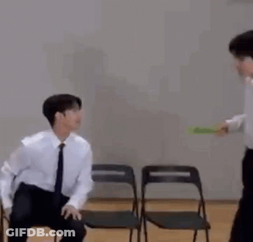 Man In Suit And Tie Sitting Next To Man GIF