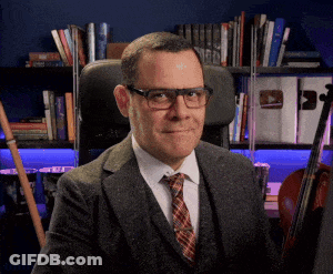Man In Suit And Tie Sitting GIF