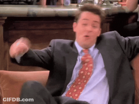 Man In Suit And Tie Sitting On Chair GIF