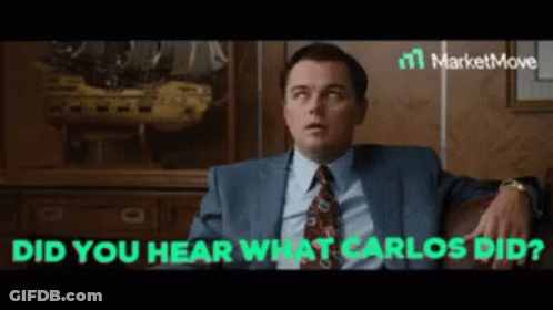 Man In Suit And Tie Sitting On Couch GIF