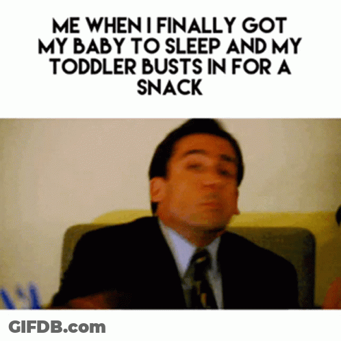 Man In Suit And Tie Sitting On Couch GIF