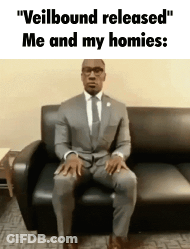 Man In Suit And Tie Sitting On Couch Saying Veilbound Released Me And My Homies GIF