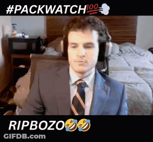 Man In Suit And Tie Sitting #Packwatch 100 GIF