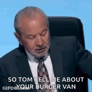 Man In Suit And Tie Sitting With Eyes Closed GIF