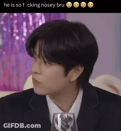Man In Suit And Tie Sitting With Wine Glass GIF