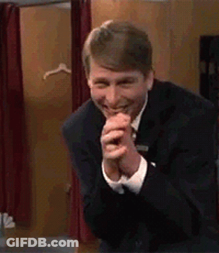 Man In Suit And Tie Smiling GIF
