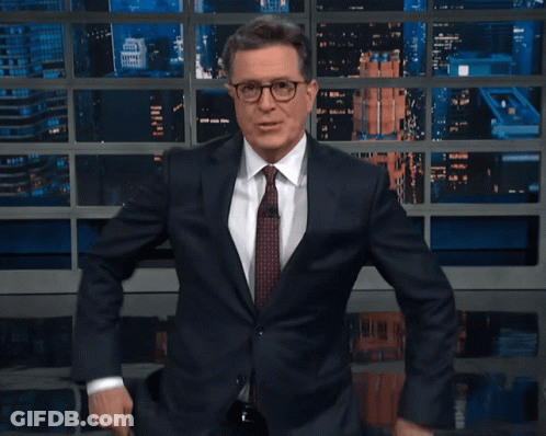 Man In Suit And Tie Smiling And Dancing GIF