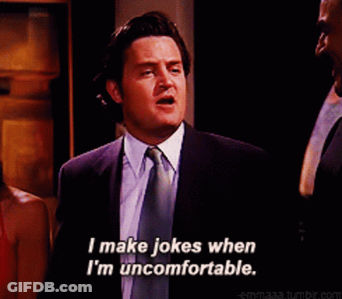 Man In Suit And Tie Smiling And Saying I Make Jokes When I'm Uncomfortable GIF