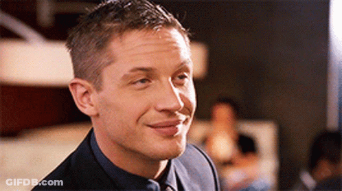 Man In Suit And Tie Smiling At Camera GIF