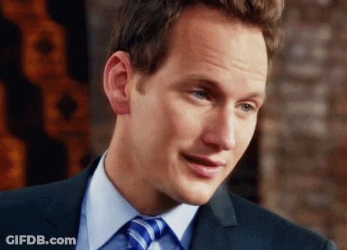 Man In Suit And Tie Smiling At Camera GIF