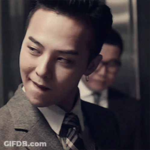 Man In Suit And Tie Smiling At Camera GIF