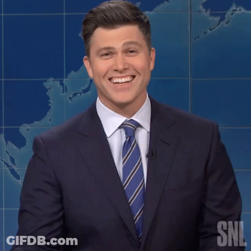 Man In Suit And Tie Smiling At SNL GIF