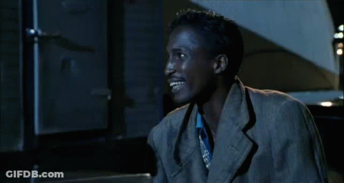 Man In Suit And Tie Smiling At Table With Woman GIF
