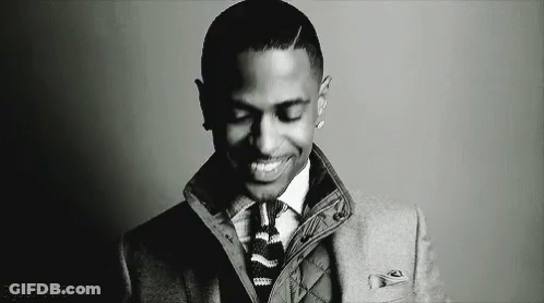 Man In Suit And Tie Smiling Black And White GIF