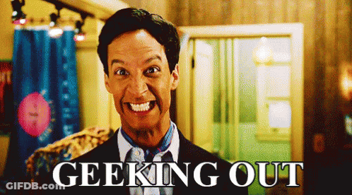 Man In Suit And Tie Smiling Geeking Out GIF