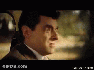 Man In Suit And Tie Smiling In Car GIF