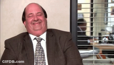 Man In Suit And Tie Smiling In Office GIF