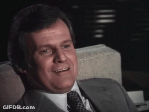 Man In Suit And Tie Smiling GIF