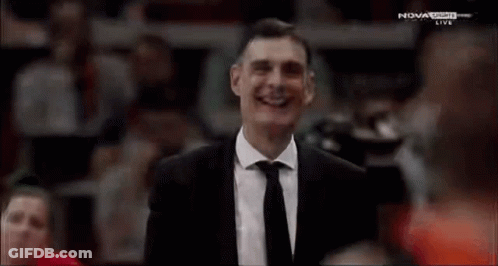Man In Suit And Tie Smiling Nova Sports Game GIF