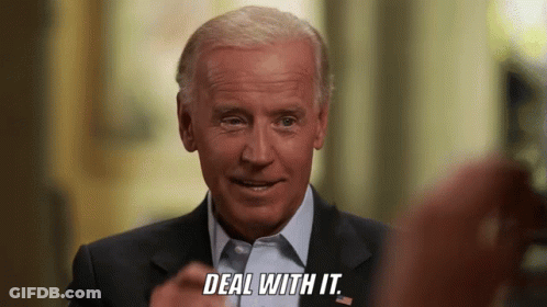 Man In Suit And Tie Smiling Says Deal With It GIF