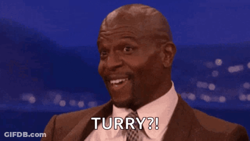 Man In Suit And Tie Smiling Says Turry GIF