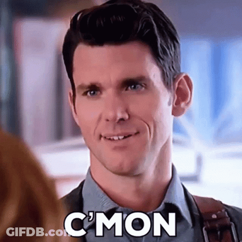 Man In Suit And Tie Smiling While Talking To Woman GIF