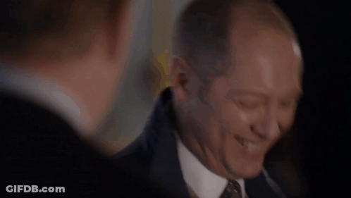Man In Suit And Tie Smiling With Eyes Closed GIF