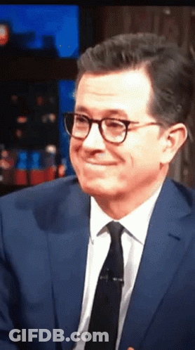 Man In Suit And Tie Smiling With Glasses GIF