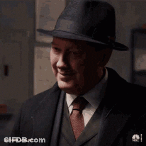 Man In Suit And Tie Smiling With Hat GIF