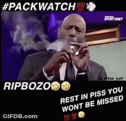 Man In Suit And Tie Smoking Cigar At Microphone GIF