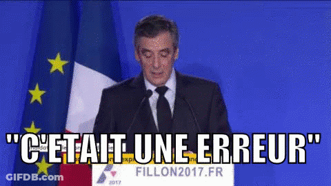 Man In Suit And Tie Speaking At Podium With Flag GIF